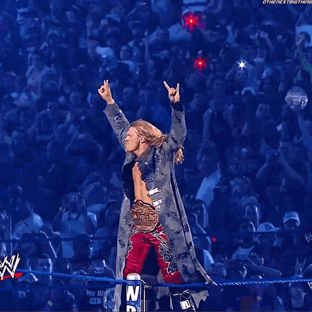 a man in a wrestling ring with the word wwe on the bottom