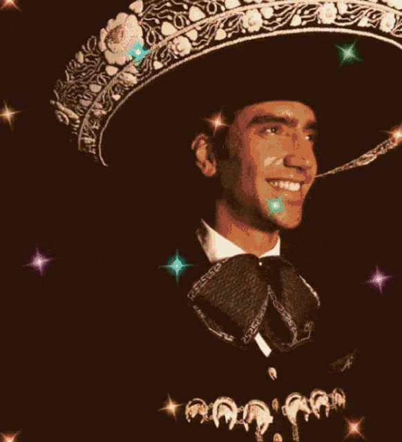 a man wearing a sombrero and a bow tie smiles with a heart in the background