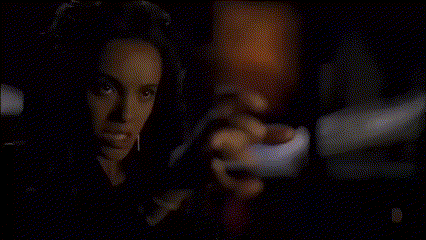 a blurry picture of a woman 's face with a light behind her