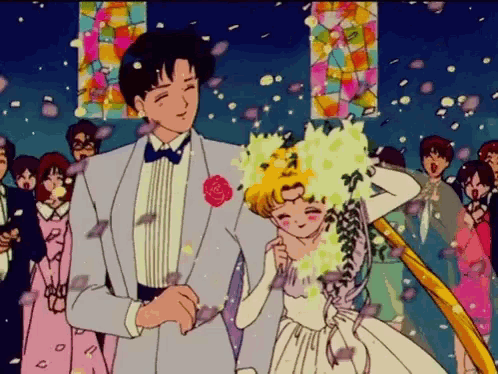 a man in a tuxedo and a woman in a wedding dress are dancing in front of a crowd