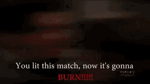 a man and woman are kissing on a bed with the words `` you lit this match , now it 's gonna burn '' .