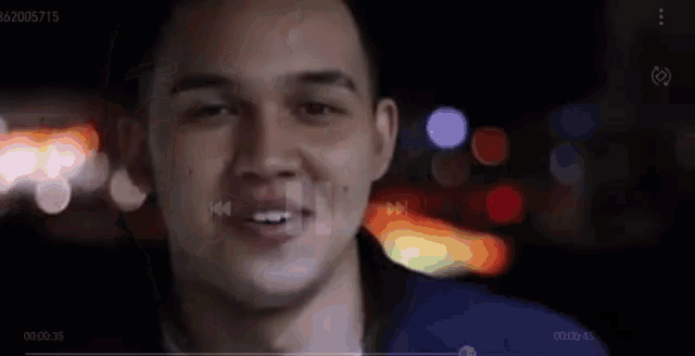 a close up of a man 's face with a blurred background and the number 62605715 on the bottom right