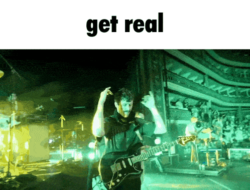 a man playing a guitar on a stage with the word get real above him