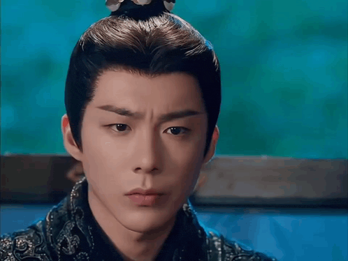 a close up of a man with a crown on his head