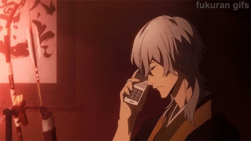 a gif of a man talking on a cell phone with the words fukuran gifs below him