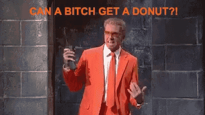a man in a red suit is holding a gun and says can a bitch get a donut !