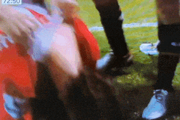 a soccer player is being tackled by another player with the time of 2:50