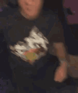 a blurry picture of a person wearing a yellow hat .