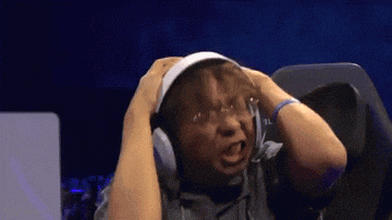 a man wearing headphones is making a funny face with his hands on his head