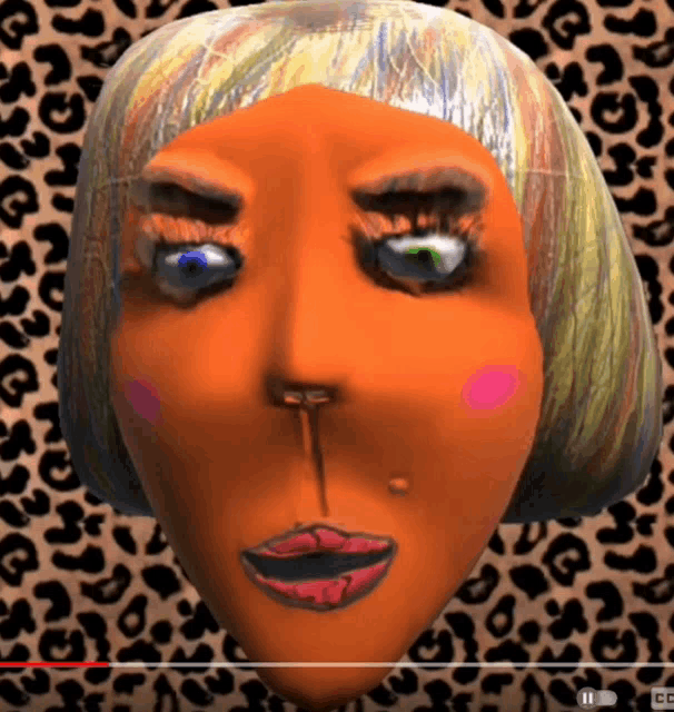 a video of a woman 's face with a leopard print background is being played