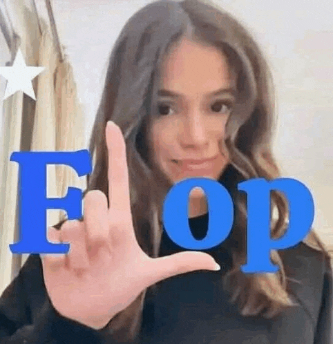 a woman is making a middle finger sign with her hand in front of the word eop .