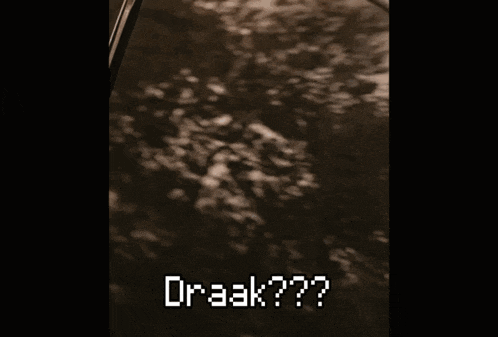 a man with a mustache is sitting in a car and the word draak is written on his face