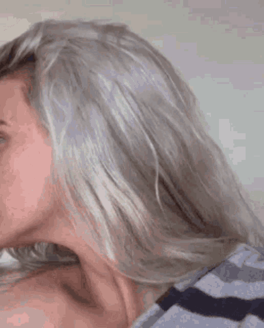 a close up of a woman 's face and neck