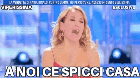 a woman in a red dress with the words anoi ce spicci casa