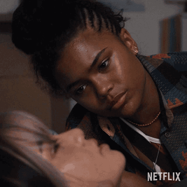a netflix advertisement shows a woman talking to another woman who is laying on the floor