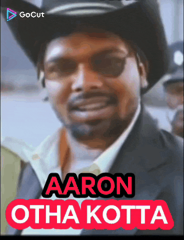 a man wearing a cowboy hat and sunglasses with the name aaron otha kotta