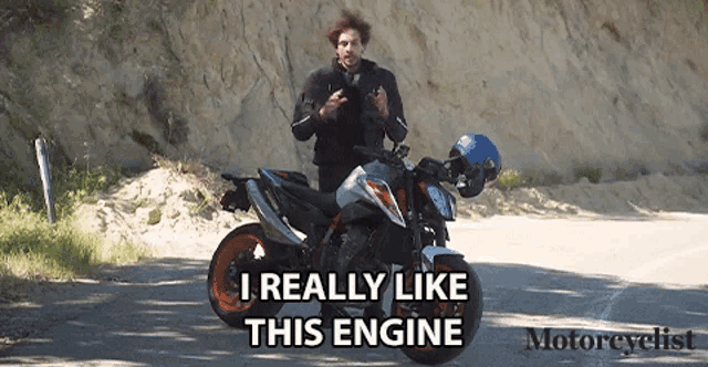 a man standing next to a motorcycle with the words " i really like this engine "