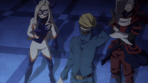 a man in a suit and a woman in a mask are standing next to each other in a room