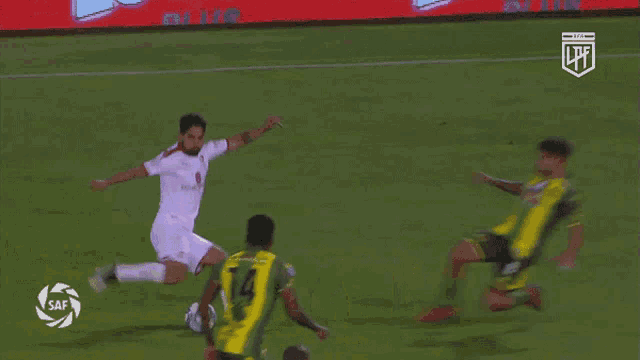 a soccer player wearing a yellow jersey with the number 4 on it