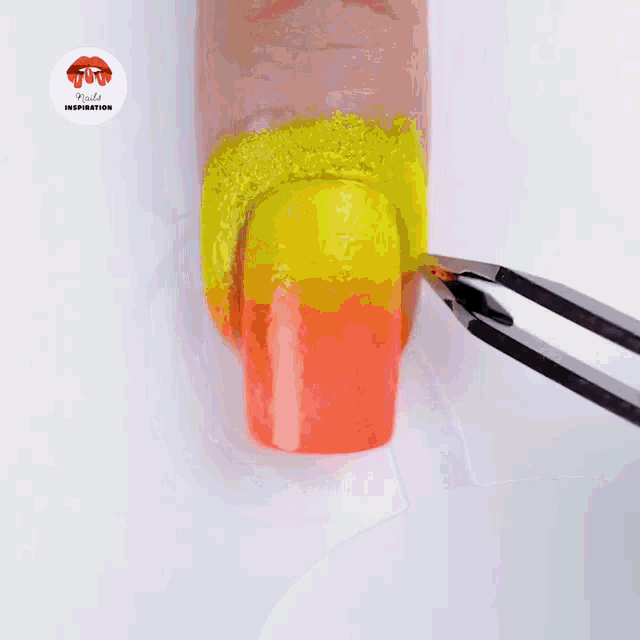 a close up of a person painting their nails with a nail polish brush