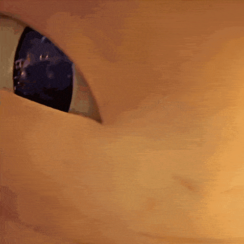 a close up of a cartoon character 's mouth with teeth visible