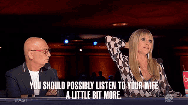 a man and a woman are sitting in front of microphones with the words you should possibly listen to your wife