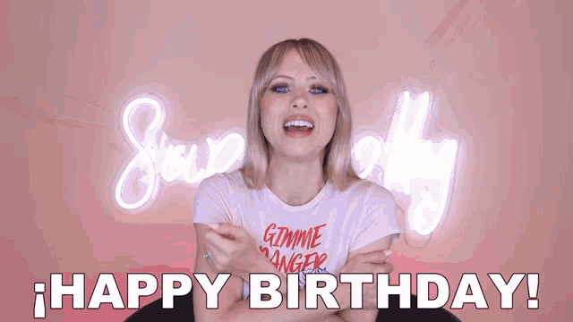 a woman wearing a shirt that says gimme anger is smiling and says happy birthday
