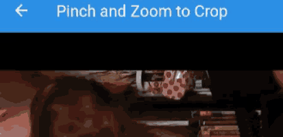 a blue screen with a pinch and zoom to crop button on it