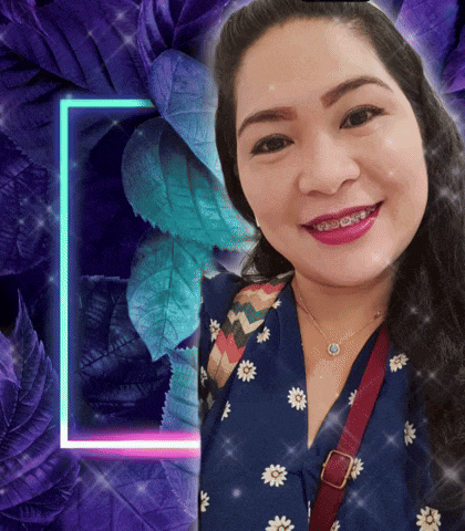a woman with braces on her teeth smiles in front of purple flowers