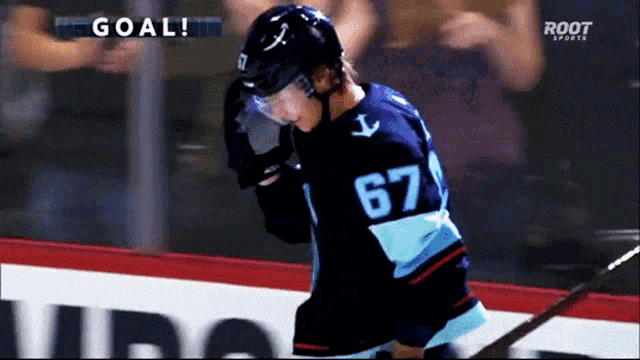 a hockey player with the number 67 on his shirt