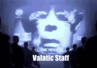 a group of people looking at a screen that says " valatic staff " on it