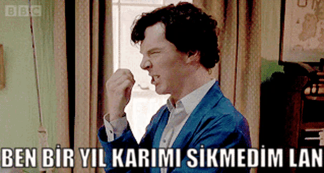 a man in a blue jacket is making a funny face with the words ben biryil karimi sikmedim lan written below him