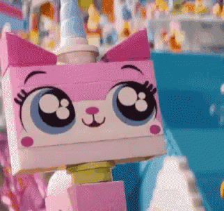 a close up of a lego cat with big eyes and a unicorn horn