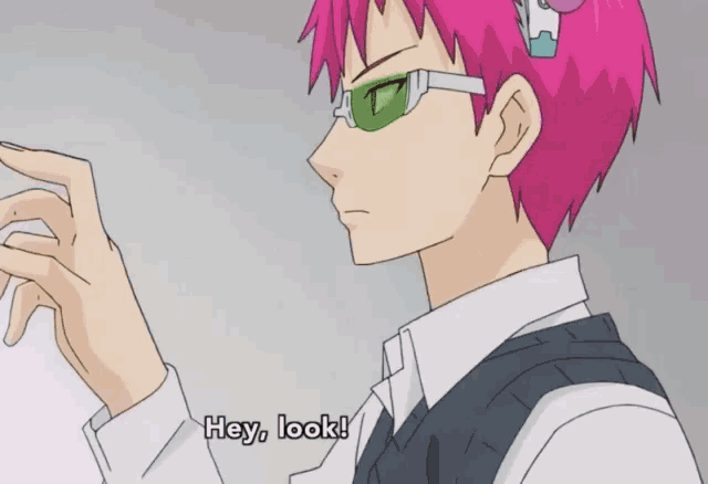a person with pink hair and green glasses says hey look