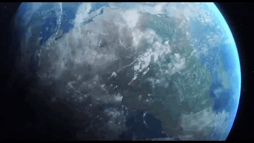 a view of the earth from space with clouds and mountains