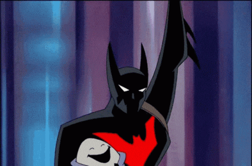 a cartoon batman is holding a baby in his arms .