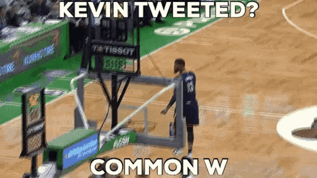 a basketball player with the number 13 on his jersey is standing on a basketball court