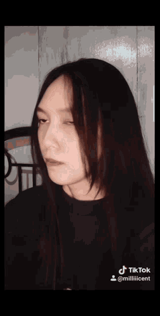 a woman 's face is shown in a tik tok video