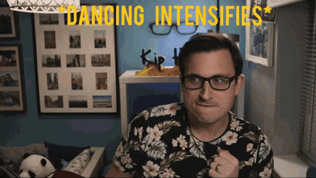 a man wearing glasses and a shirt that says dancing intensifies on it