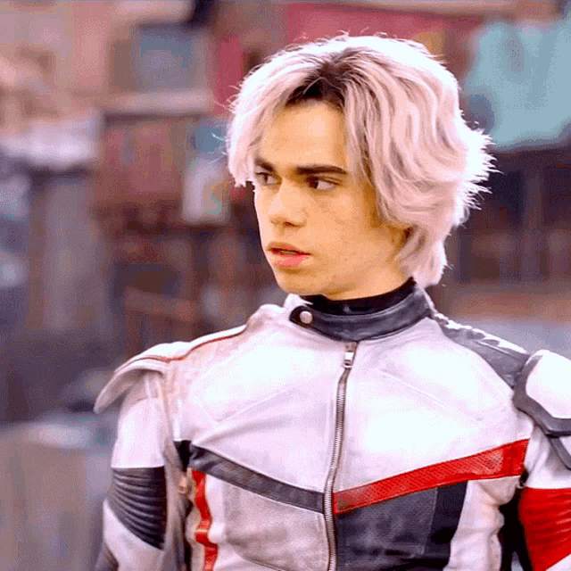 a young man with white hair is wearing a red white and black leather jacket