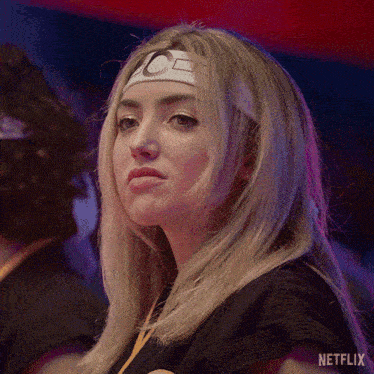 a woman wearing a headband with the letter c on it is featured on netflix