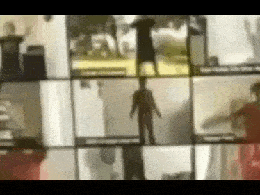 a blurred image of a group of people standing in front of a window .