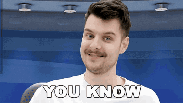 a man with a mustache is smiling with the words you know below him