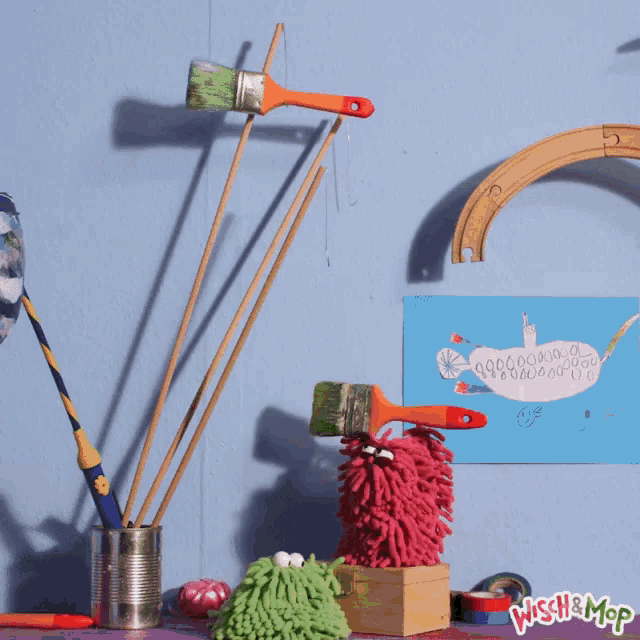 a blue wall with a poster that says wish & mop on the bottom