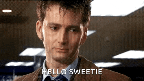 a man in a suit and tie is talking to someone and saying hello sweetie .