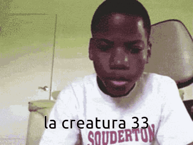 a boy wearing a shirt that says la creatura 33 souderton