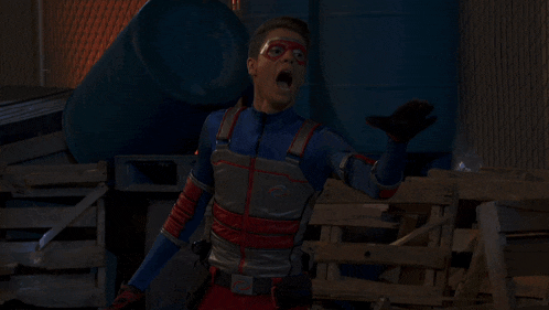 a man in a superhero costume holds a piece of bread