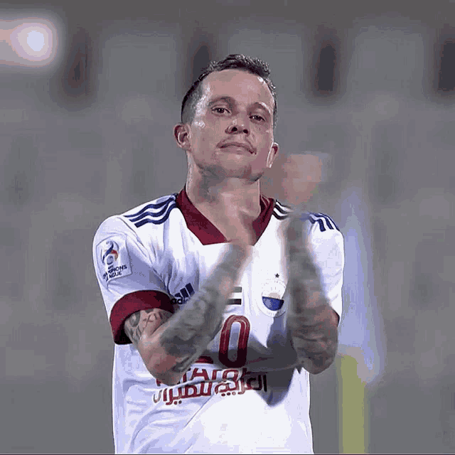 a soccer player wearing a jersey with the number 10 on it