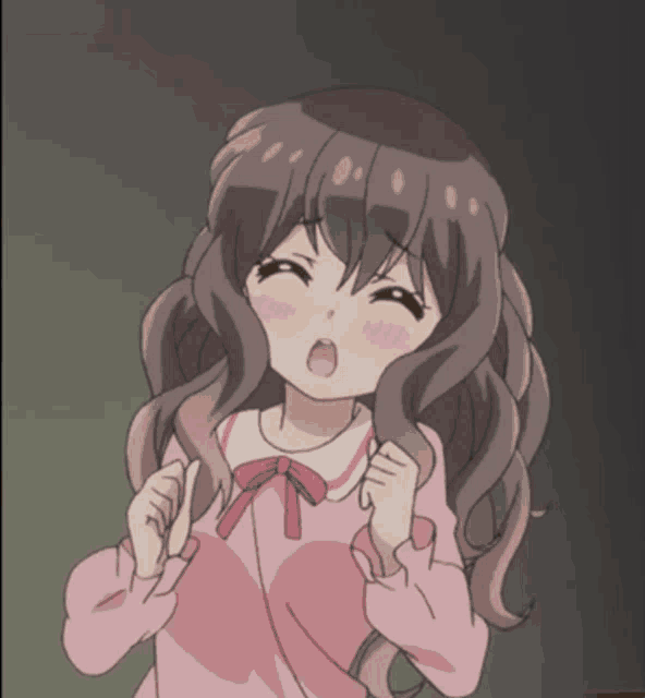 a girl with long brown hair is wearing a pink shirt with a red bow on the collar