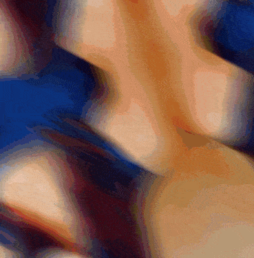 a blurry picture of a person 's torso with a blue and red background